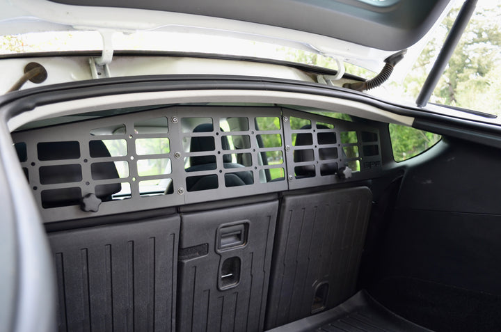BPF Molle Style Pet Barrier Tesla Model Y 2020-CURRENT installed behind rear seats, featuring durable CNC fabricated molle panels designed for a secure dog barrier in the cargo area.
