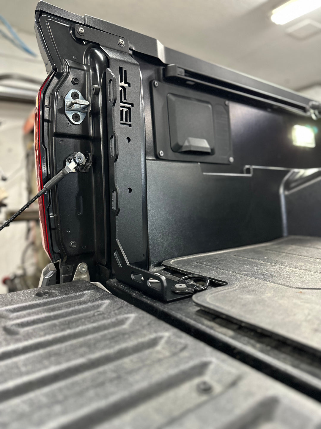 Close-up of a black BPF 2024-2025 Toyota Tacoma Bed Stiffeners installed in the truck bed corner, showing durable construction and OEM fitment.