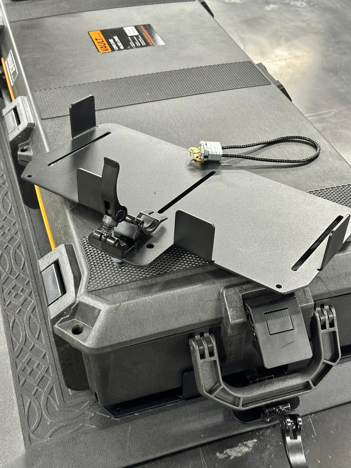 Black powder-coated steel BPF Universal Pelican Vault V700 Case Mounting brackets with adjustable clamp and locking cable, designed for secure heavy-duty case attachment.