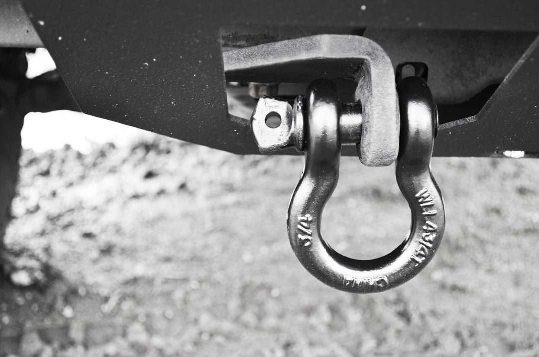 BPF 2005-2023 HD Tacoma Recovery Tow Hook Passenger Side installed on a vehicle, showing a heavy-duty shackle ready for towing or recovery tasks.