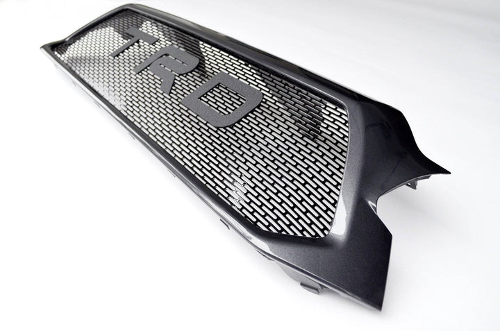 BPF Completed 2012-2015 Toyota Tacoma Grill in black with TRD lettering and a powder-coated mesh design for OEM fitment and a sleek, durable appearance.