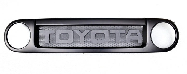 BPF 2007-2014 Toyota FJ Mesh and Lettering grille insert with black powder-coated finish featuring bold Toyota lettering and durable mesh design for OEM fitment.