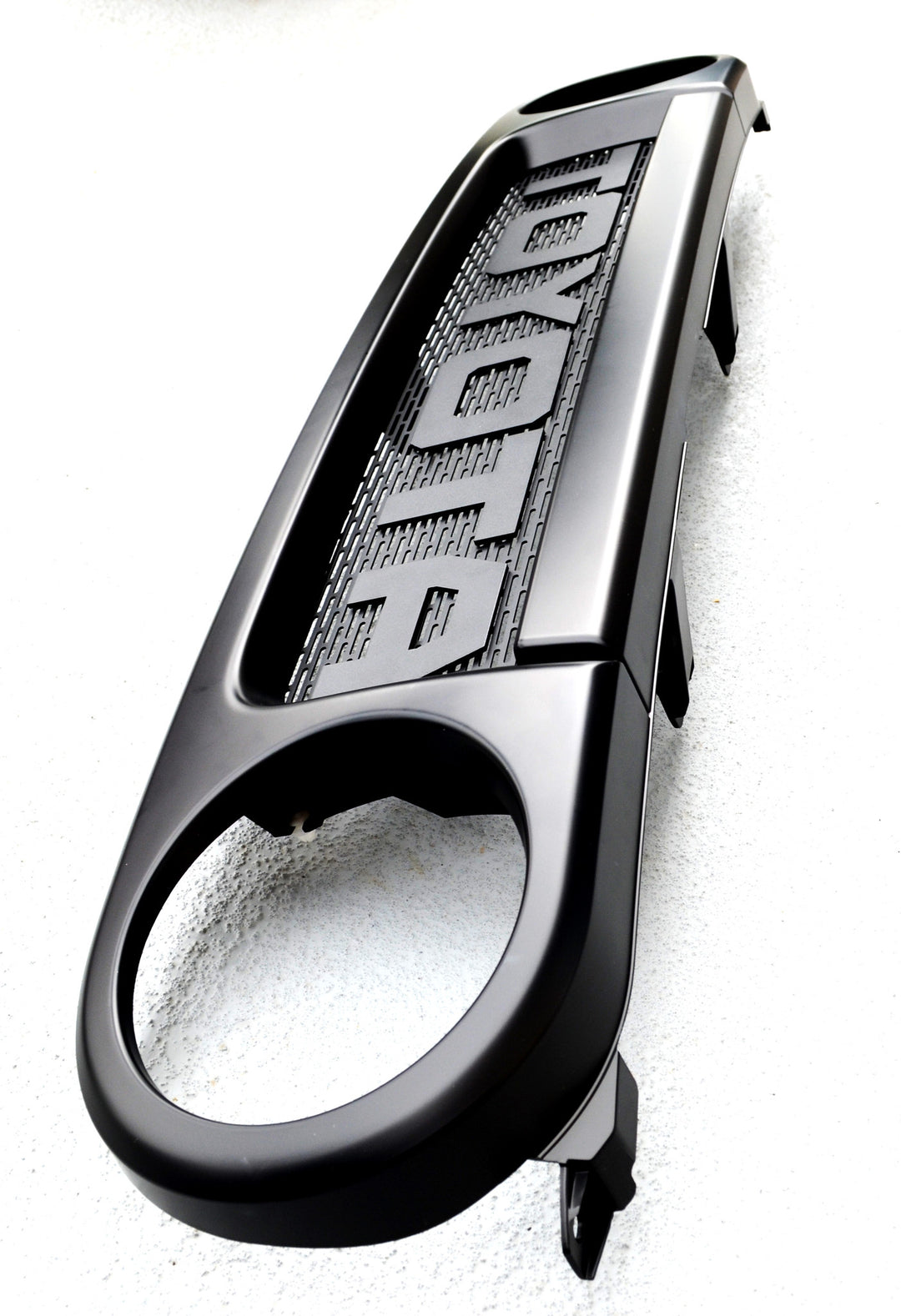 Close-up of a black automotive grille mesh and lettering detail designed for BPF 2007-2014 Toyota FJ Mesh and Lettering, featuring bold, textured design and smooth finishes.