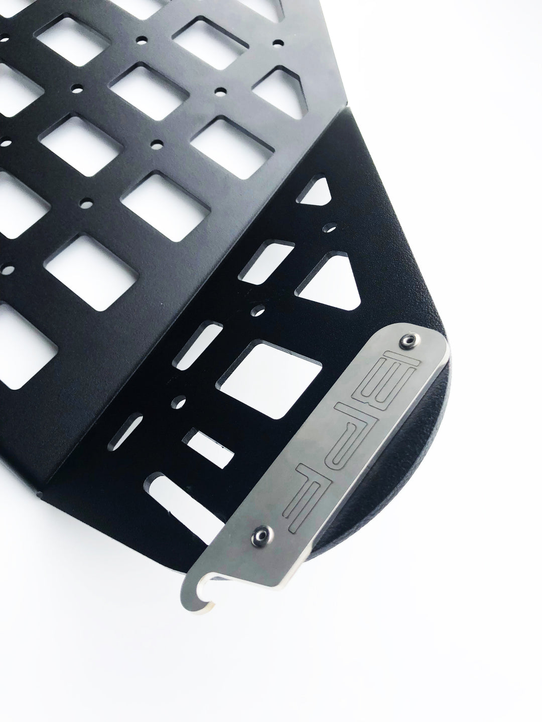 Close-up view of black CNC fabricated storage panel with MOLLE-style grid pattern featuring a metal BPF branded nameplate, part of the BPF 2010-2024 4Runner Storage Panels.