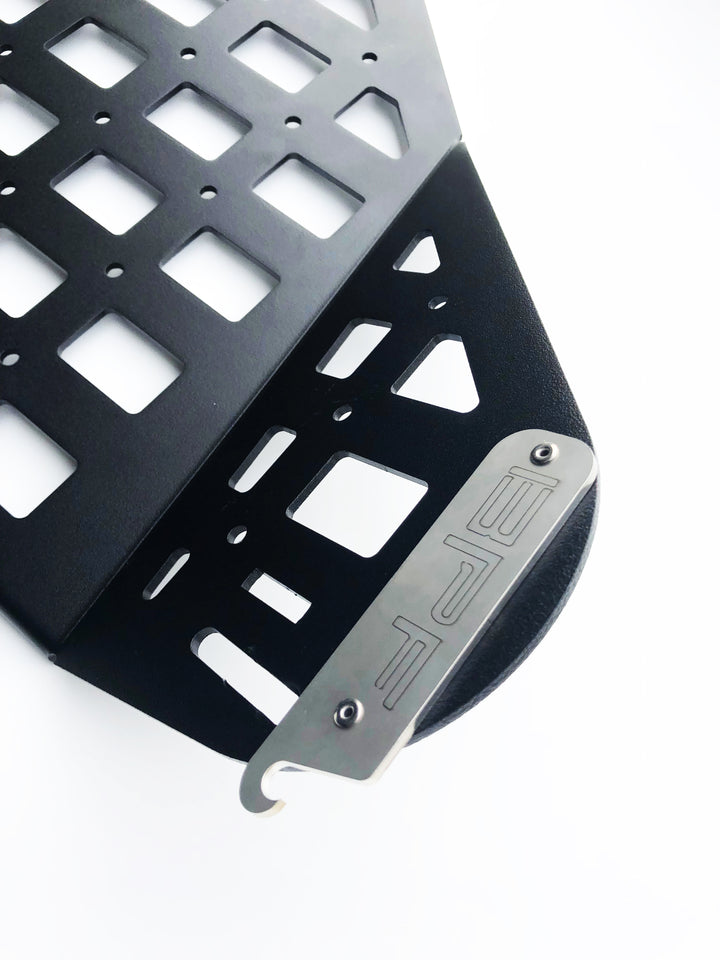 Close-up view of black CNC fabricated storage panel with MOLLE-style grid pattern featuring a metal BPF branded nameplate, part of the BPF 2010-2024 4Runner Storage Panels.