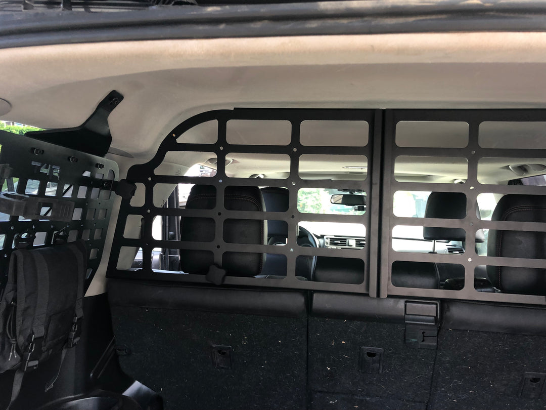 BPF Molle Style Pet Barrier 5th Gen Toyota 4Runner 2010-2024 installed behind rear seats with black molle panel design, providing a durable dog barrier for SUV interior safety.
