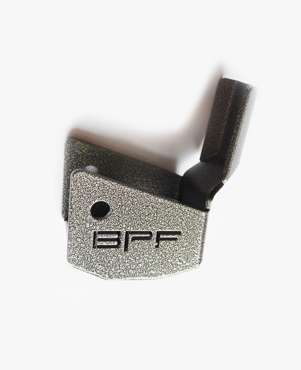 Close-up of a powder-coated metal automotive part with an embossed BPF logo, designed as a BPF 4runner 04-24/FJ 07-14 Shock Guards component for heavy-duty vehicle protection.